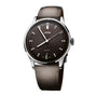 Oris Artelier watch with silver case, black dial, rectangular hour markers, date window, and brown leather strap.