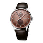 Silver and rose gold watch with moonphase subdial, brown leather strap, and secondary dial showing date and time complication