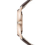 Side view of the Jaeger-LeCoultre Master Ultra Thin Date, a slim pink gold watch with a brown leather strap and logo-engraved crown, featuring an elegant case housing the precise Caliber 899 movement. Watch face not shown.