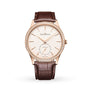 The Jaeger-LeCoultre Master Ultra Thin Small Seconds features a rose gold case, diamond bezel, white dial with gold hour markers, small seconds subdial at 6 o’clock, and a brown leather strap.
