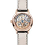 The back view of the Jaeger-LeCoultre Rendez-Vous Moon Medium reveals its intricate mechanical movement through a transparent case, featuring a gold rim and a black leather strap with white stitching.