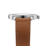A side view of the Jaeger-LeCoultre Master Control Date shows its stainless steel case, plain crown, and brown leather strap with visible stitching. The watch face is not visible.