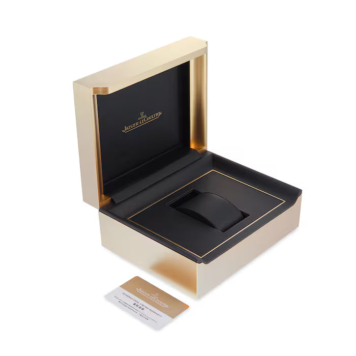An open gold and black Jaeger-LeCoultre box with a cushion is displayed on a white background, accompanied by a branded card—ideal for presenting your Jaeger-LeCoultre Rendez-Vous Night & Day watch.