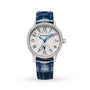 The Jaeger-LeCoultre Rendez-Vous Night & Day is a luxury Swiss watch with a blue leather strap, diamond bezel, silver dial with black Arabic numerals, blue hands, and a moon phase display above 6 o’clock.