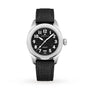A Zenith Pilot Automatic wristwatch with a black textured dial, white numerals, silver hands, and a black fabric strap is shown on a white background.