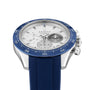 A Zenith Chronomaster Sport Centenary Exclusive chronograph watch with a blue bezel, white dial, three subdials, and a blue rubber strap is displayed at an angle, showcasing Zenith precision at Watches of Switzerland.