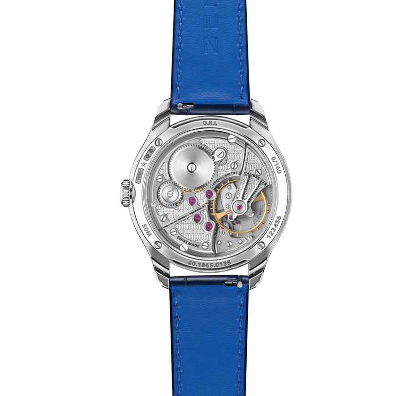 Back view of the Zenith G.F.J Calibre 135 luxury watch, showcasing its exposed mechanical movement and blue leather strap.