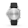 Back view of the Panerai Luminor Chrono, a luxury sports watch with stainless steel case, engraved markings, black leather strap, and Panerai’s signature visible crown guard.