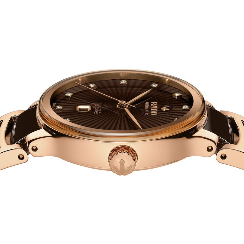 A close-up side view of the Rado Centrix Automatic Diamonds watch, showcasing a rose gold case, black dial with diamond hour markers, and a matching bracelet—a hallmark of Swiss luxury.