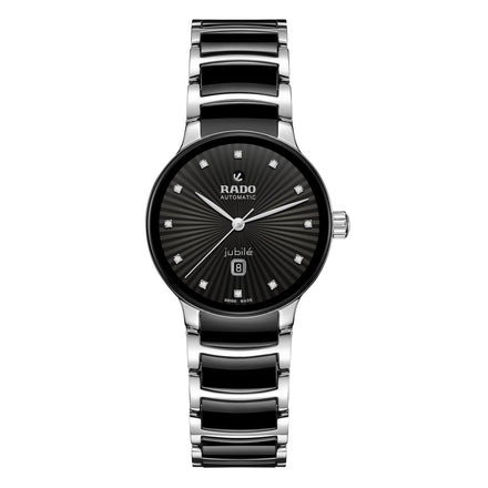 A Rado Centrix Automatic Diamonds wristwatch in silver and black, featuring a black patterned dial, diamond hour markers, and a date display at 6 oclock.