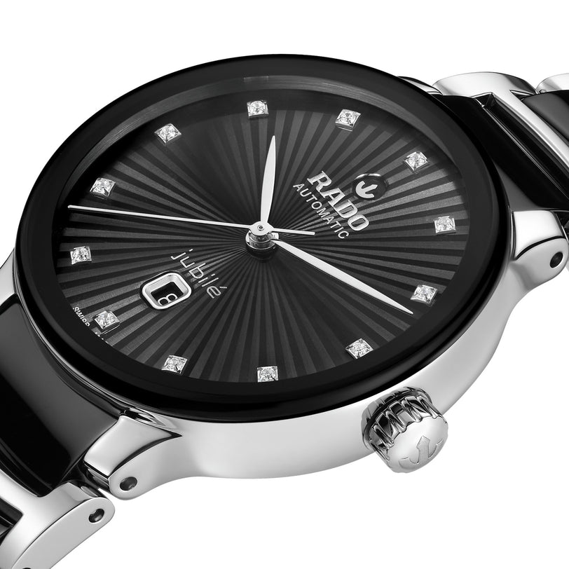 Close-up of the Rado Centrix Automatic Diamonds watch, featuring a black dial, silver hour markers with diamond accents, and a date display at 6 oclock.