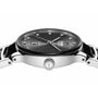 Close-up side view of the Rado Centrix Automatic Diamonds watch in silver with a black sunburst-patterned dial, diamond hour markers, high-tech ceramic details, and a crown embossed with the logo.