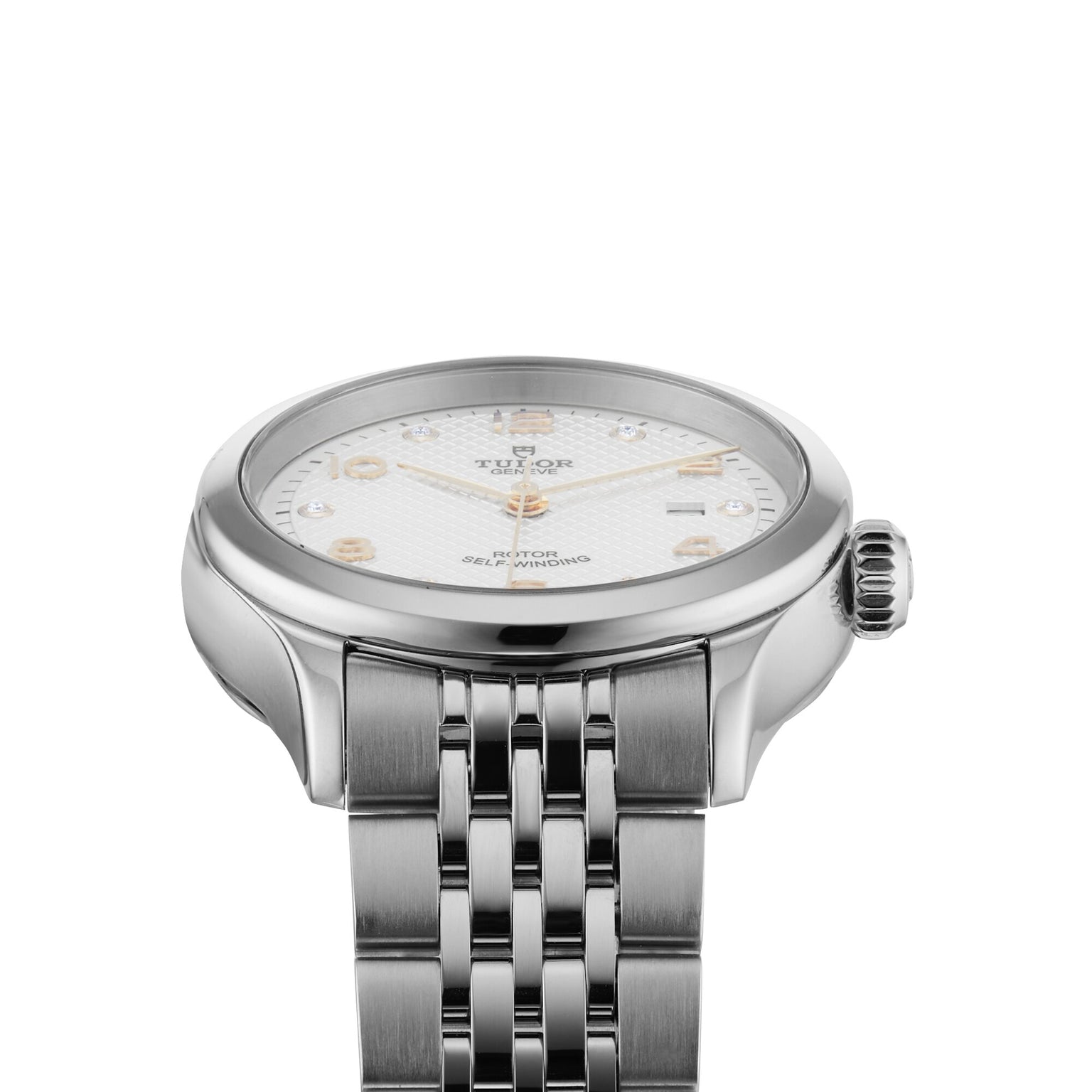 A close-up of the TUDOR 1926, a silver wristwatch with a white textured dial, diamond hour markers, and stainless steel bracelet, featuring a self-winding movement, photographed on a white background.