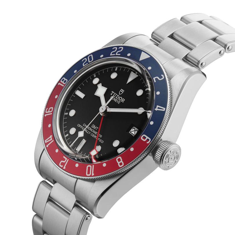 The TUDOR Black Bay GMT wristwatch features a stainless steel band, black dial, and a red and blue 24-hour bezel—an iconic choice for fans of classic diving watches.