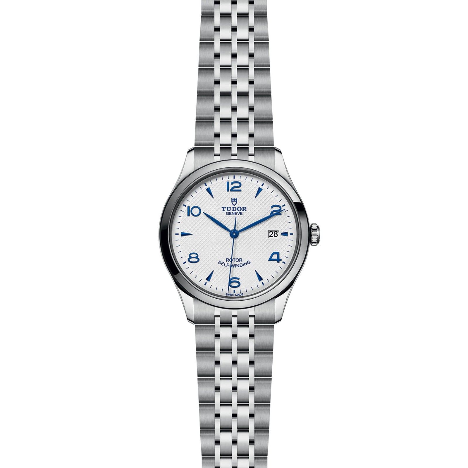 The TUDOR 1926 is a stainless steel wristwatch with a white dial, blue Arabic numerals, date display at 3 o’clock, and metal link bracelet—an elegant mechanical timepiece.