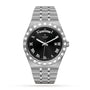 The TUDOR Royal is a stainless steel and gold wristwatch with a black dial, Roman numerals, day at 12 o’clock, date at 3 o’clock, and link bracelet—combining automatic sport-chic style with advanced performance.