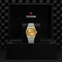 A TUDOR Royal wristwatch is presented in an open black box featuring the Tudor logo on the inside lid, highlighting the brands signature sport-chic style and automatic watch craftsmanship.
