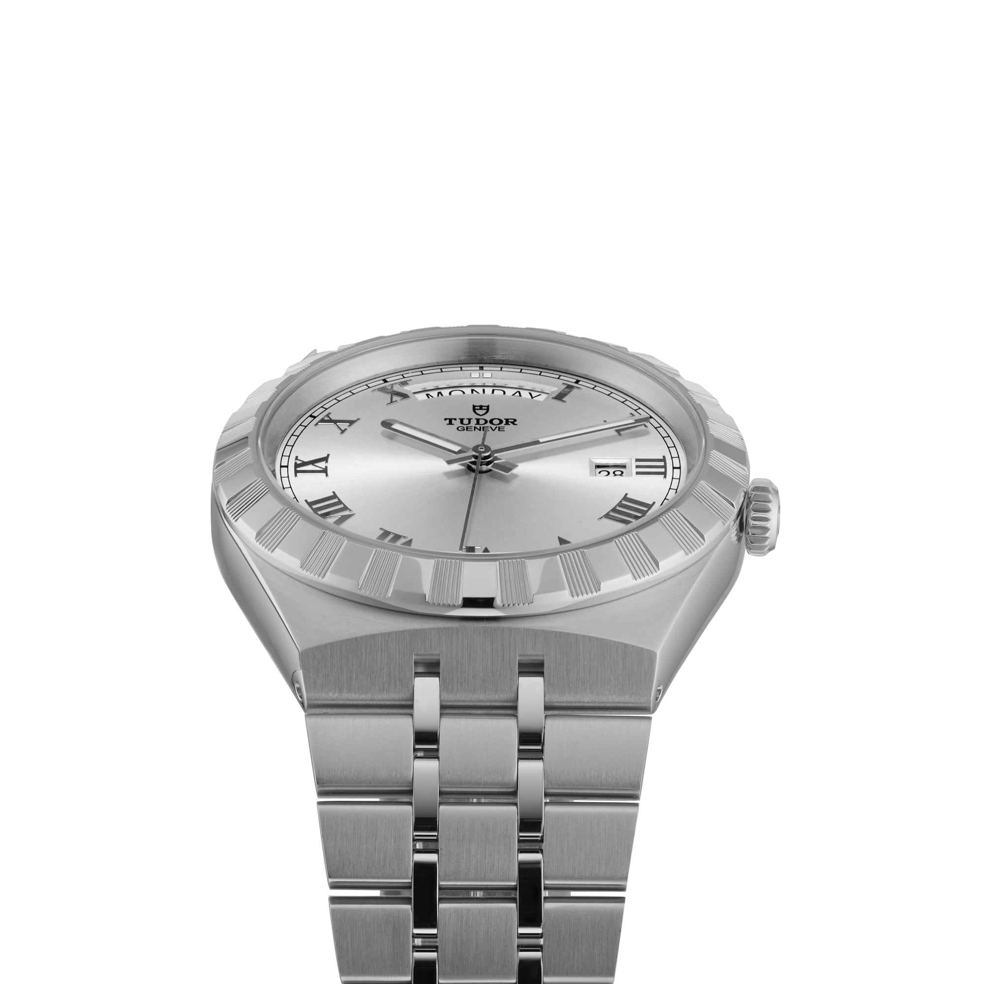 The TUDOR Royal silver wristwatch, featuring Roman numeral markers, a date window at 3 o’clock, fluted bezel, and integrated bracelet, is displayed against a white background—a showcase of automatic sport-chic style.