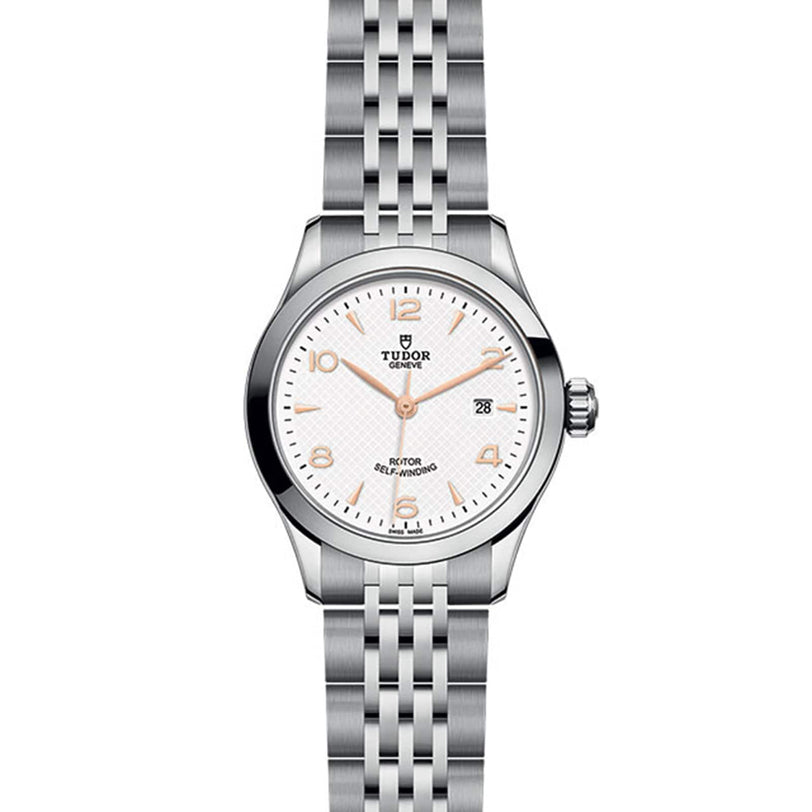 The TUDOR 1926 is a classic wristwatch with a stainless steel case, white dial, date at 3 o’clock, and silver metal bracelet—ideal for those who appreciate timeless mechanical watches.
