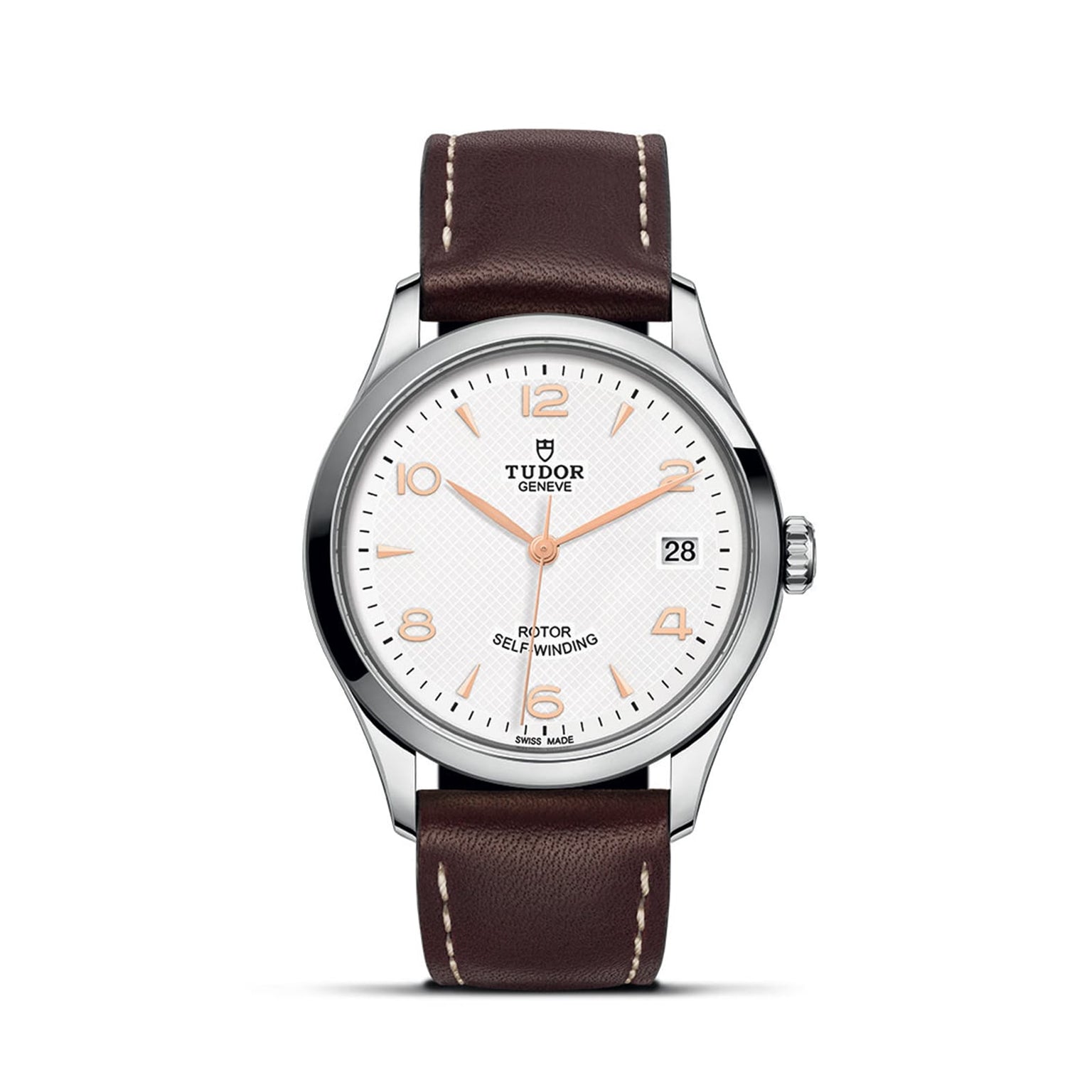 The TUDOR 1926 features a white textured dial, brown leather strap, silver case, gold-tone markers, date at 3 o’clock, and ROTOR SELF-WINDING text—a classic elegant wristwatch.