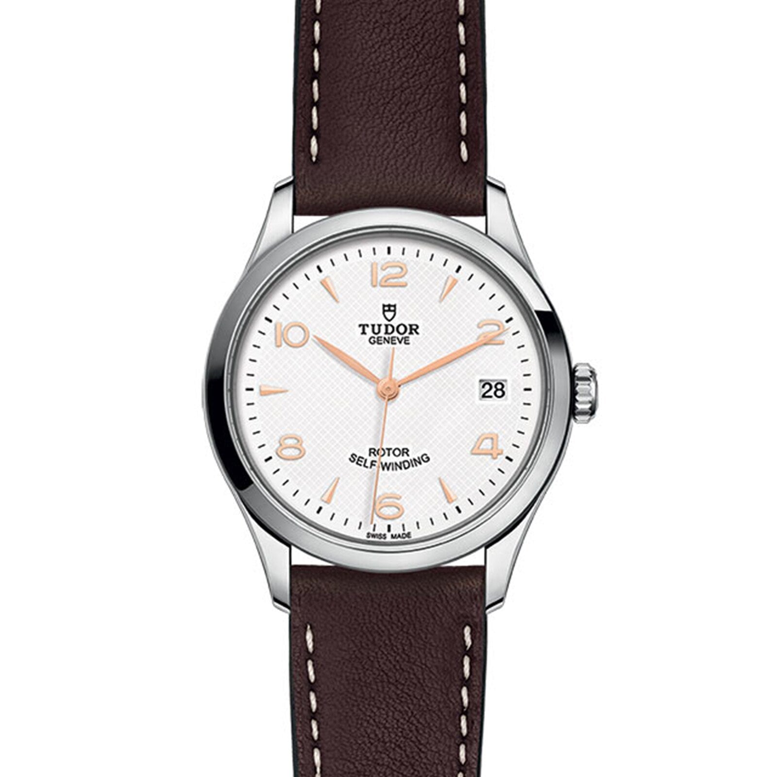 The TUDOR 1926 wristwatch features a white dial, brown leather strap, and date display at 3 o’clock.