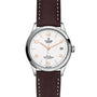 The TUDOR 1926 wristwatch features a white dial, brown leather strap, and date display at 3 o’clock.