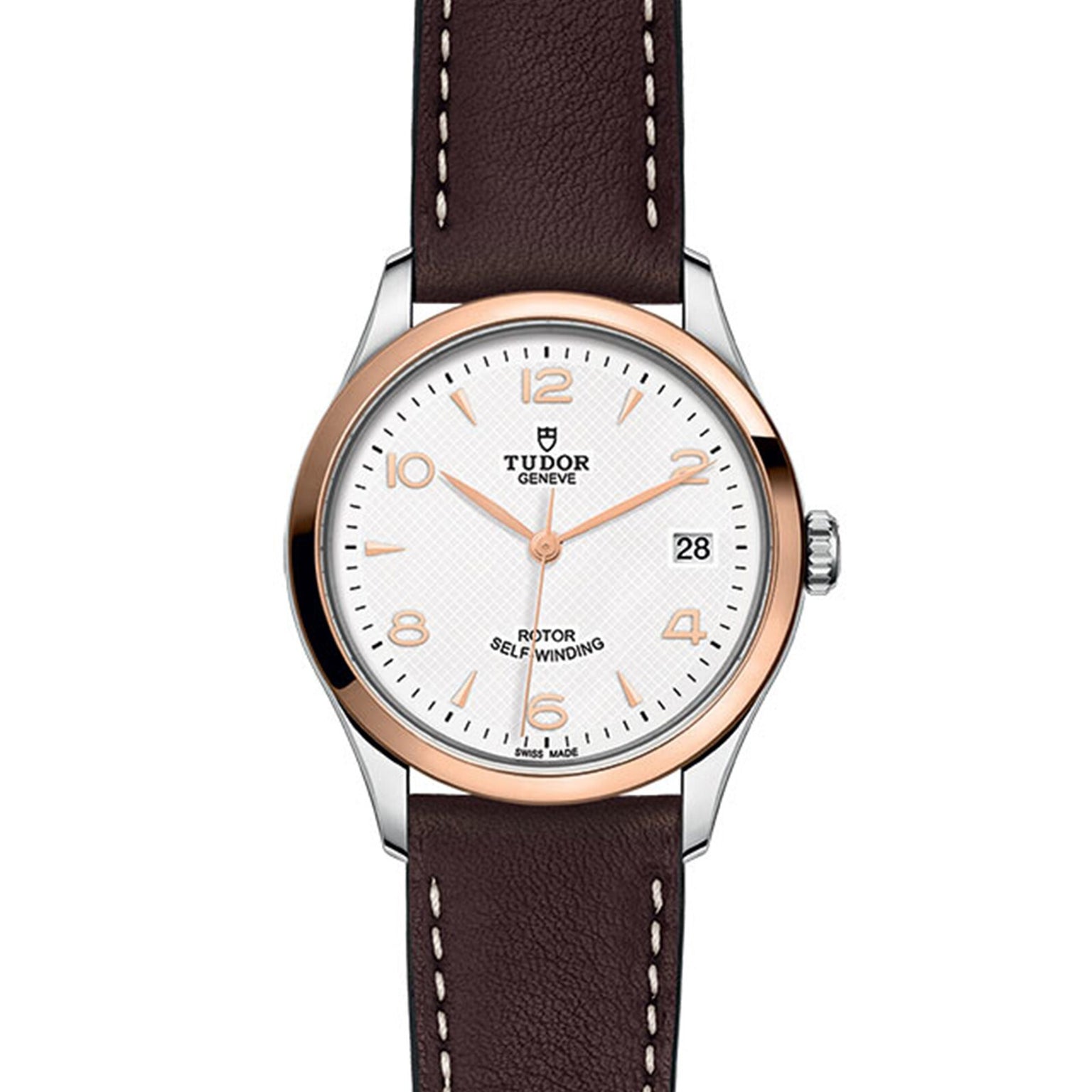 The TUDOR 1926 wristwatch features a white textured dial, gold-tone markers, date at 3 o’clock, brown leather strap, and a stainless steel and gold bezel—honoring the brand’s classic mechanical watch heritage.