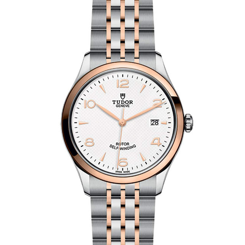 The TUDOR 1926 features a white dial, gold hour markers, date display, and a two-tone silver and gold bracelet—classic elegance for fine mechanical watch enthusiasts.