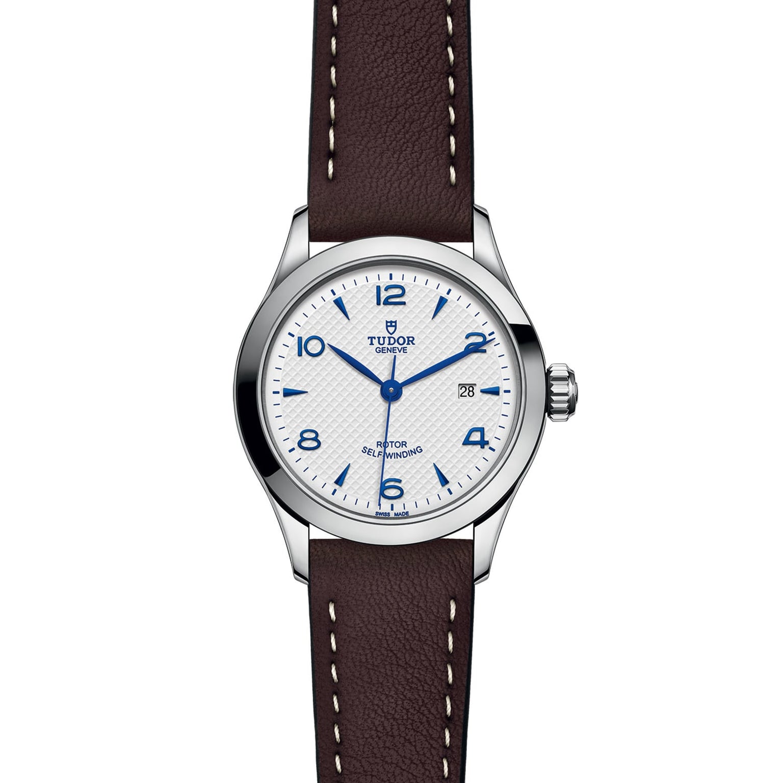 The TUDOR 1926 wristwatch features a white dial with blue numerals, date display at 3 o’clock, silver bezel, and a brown leather strap with white stitching—highlighting classic mechanical watch elegance.