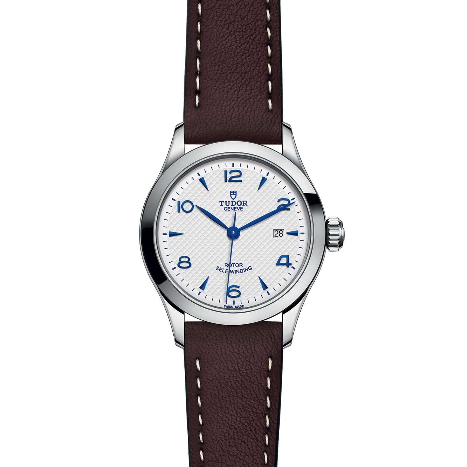 The TUDOR 1926 wristwatch features a white dial with blue numerals, date display at 3 o’clock, silver bezel, and a brown leather strap with white stitching—highlighting classic mechanical watch elegance.