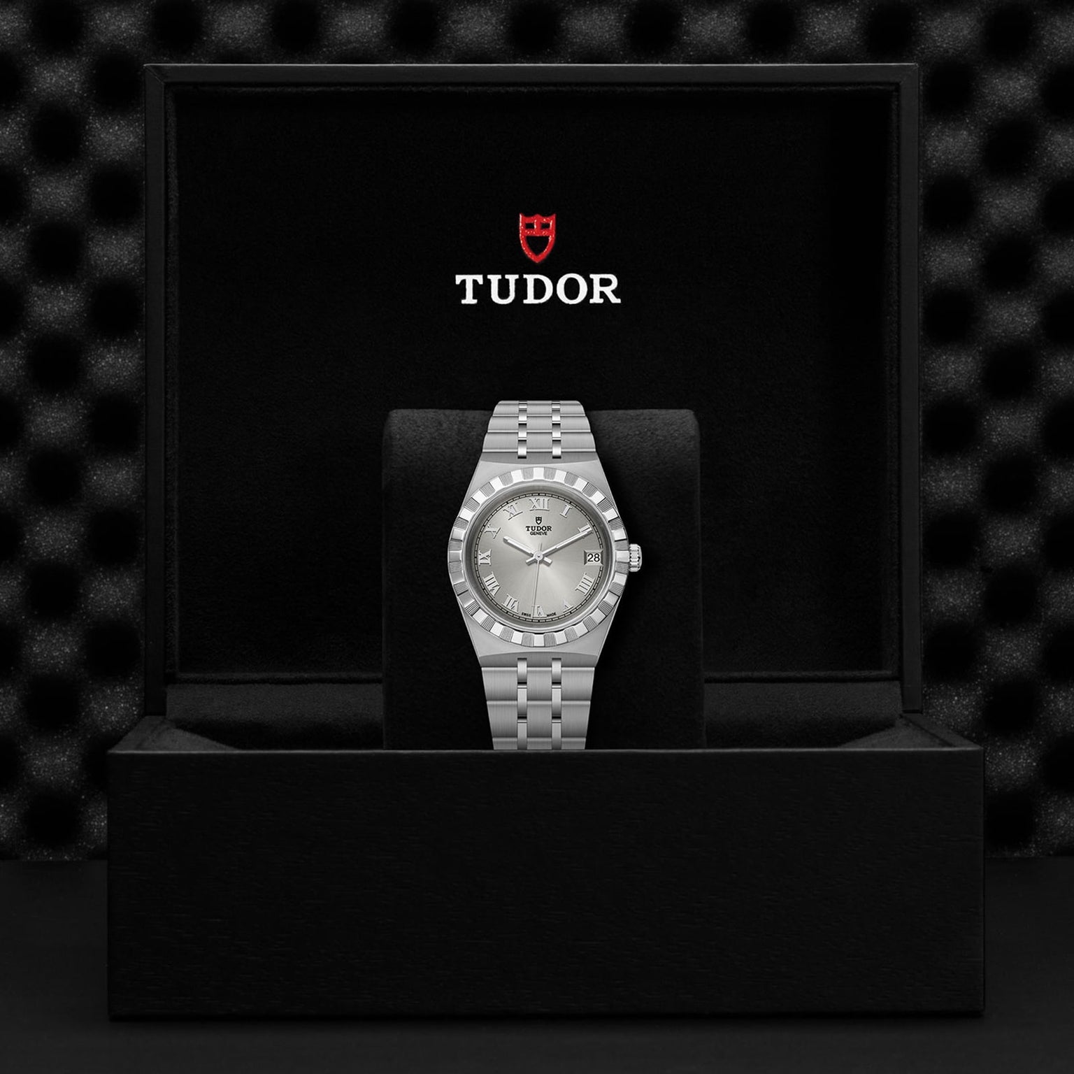 The TUDOR Royal wristwatch, combining stainless steel and gold, is presented upright in a black Tudor box—ideal for fans of automatic sport-chic timepieces.