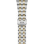 The TUDOR Royal bracelet features a two-tone metal design with alternating silver and gold links, finished with a clasp engraved with the TUDOR logo, inspired by the Royal range.