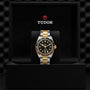 The TUDOR Black Bay GMT S&G, featuring a black and yellow gold bezel, black dial, and silver and gold bracelet, is displayed in an open black TUDOR box—a striking example of the brand’s diver watch collection.