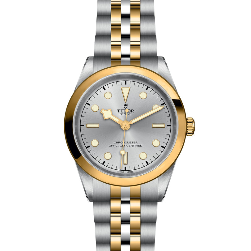 The TUDOR Black Bay One 41 S&G is a two-tone silver and gold wristwatch featuring a silver dial and metal link bracelet.