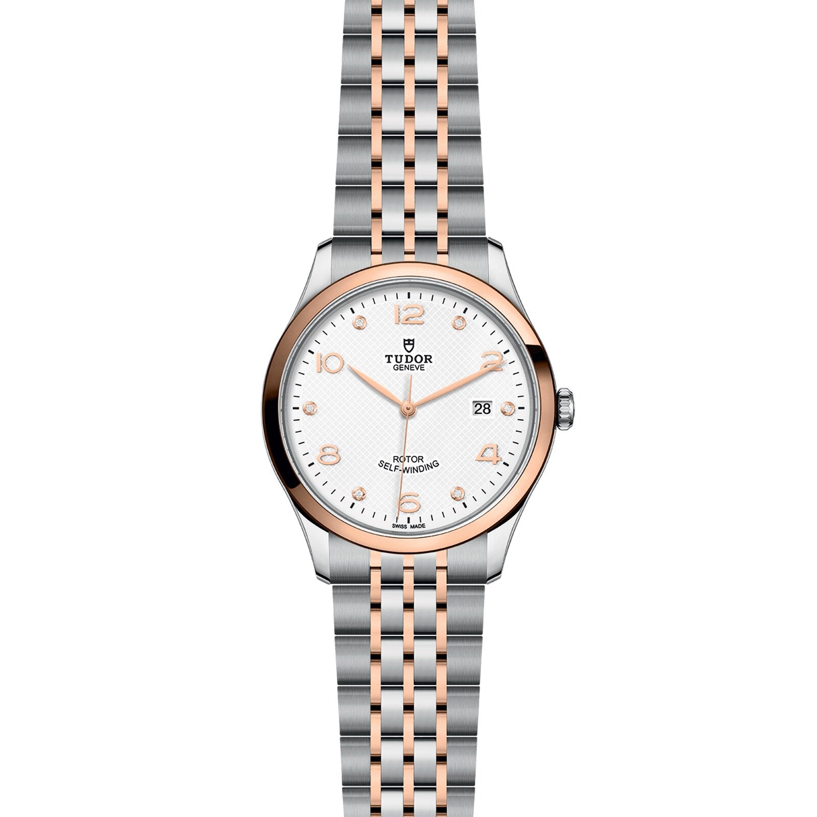 The TUDOR 1926 is a wristwatch with a silver and rose gold bracelet, white dial, gold hour markers, and a date display at 3 o’clock—an elegant tribute to classic mechanical watches.