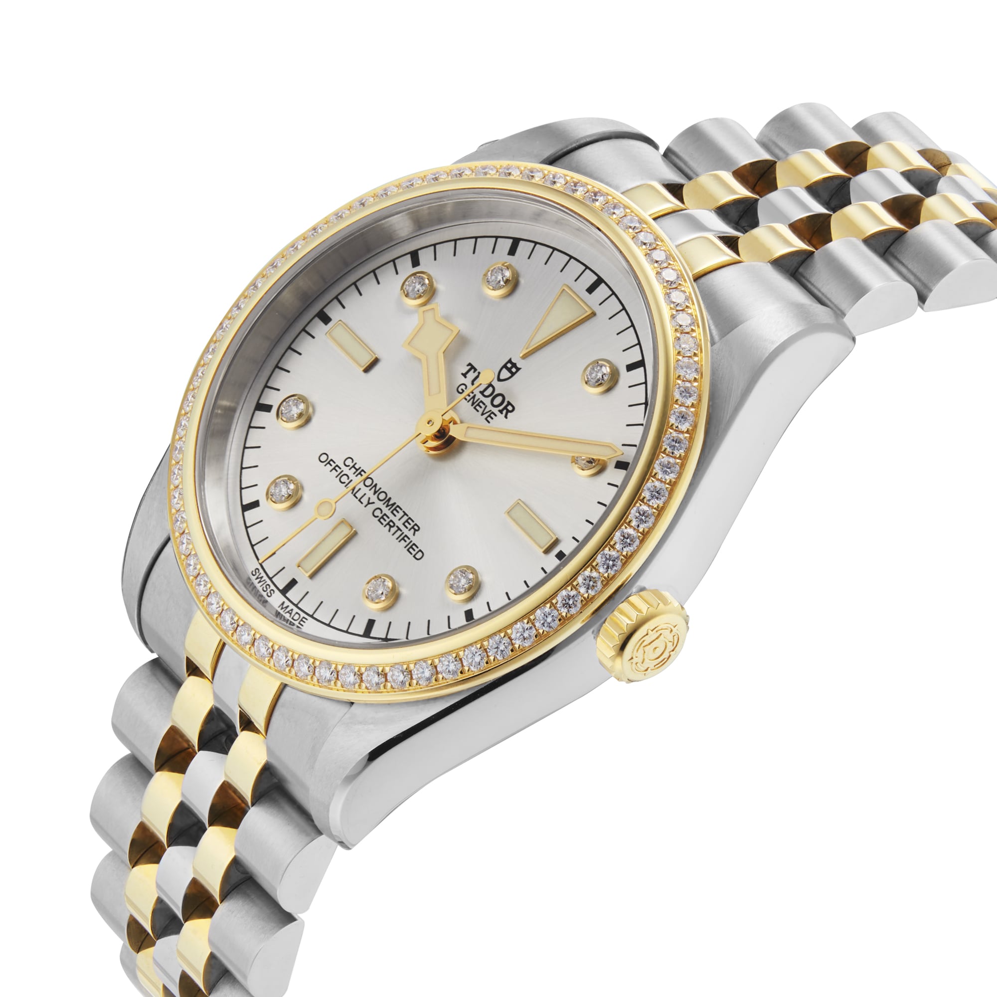 The TUDOR Black Bay One 36 S&G features a silver dial with yellow gold accents, diamond hour markers, and a diamond-set bezel on a metal bracelet.