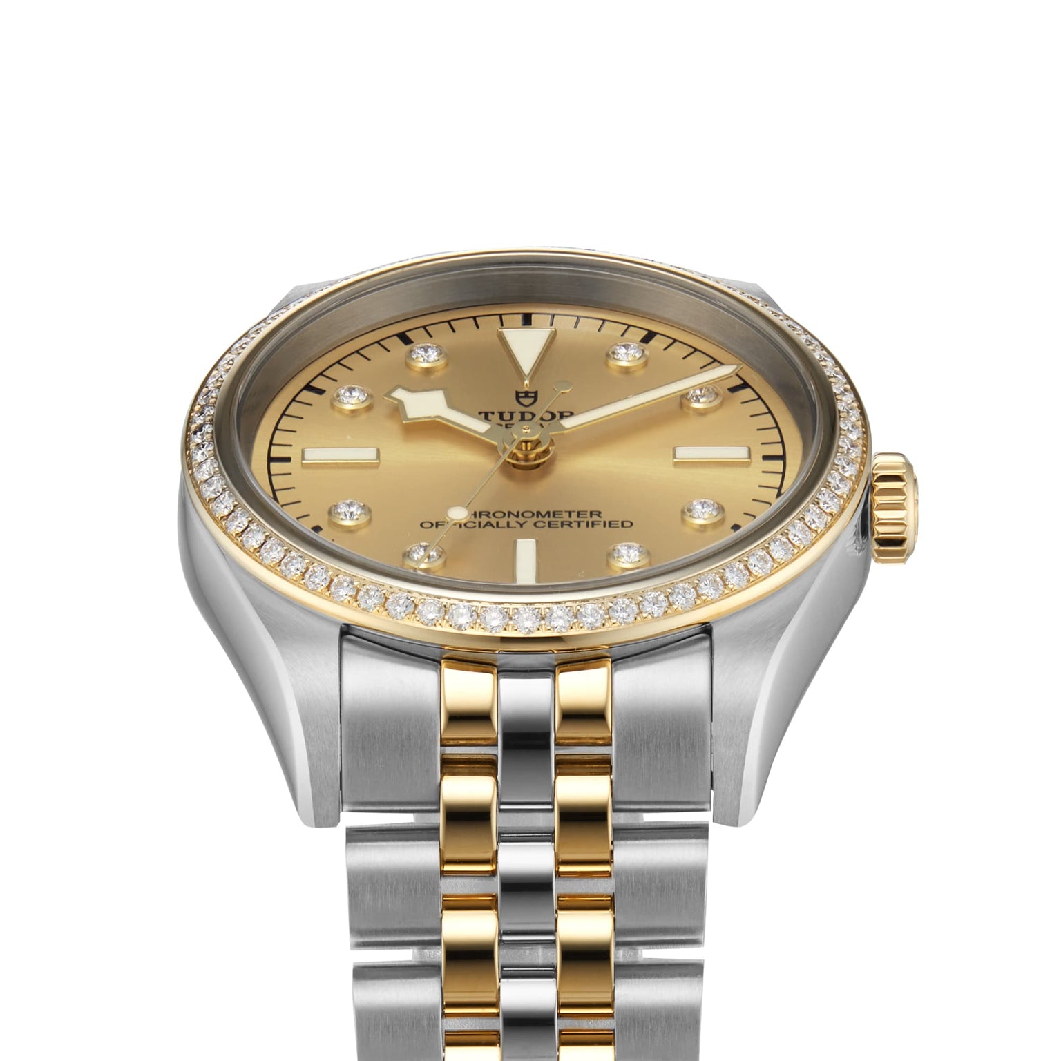 The TUDOR Black Bay One 36 S&G is a luxury wristwatch with a gold and silver band, diamond bezel, and yellow gold dial adorned with diamond hour markers.