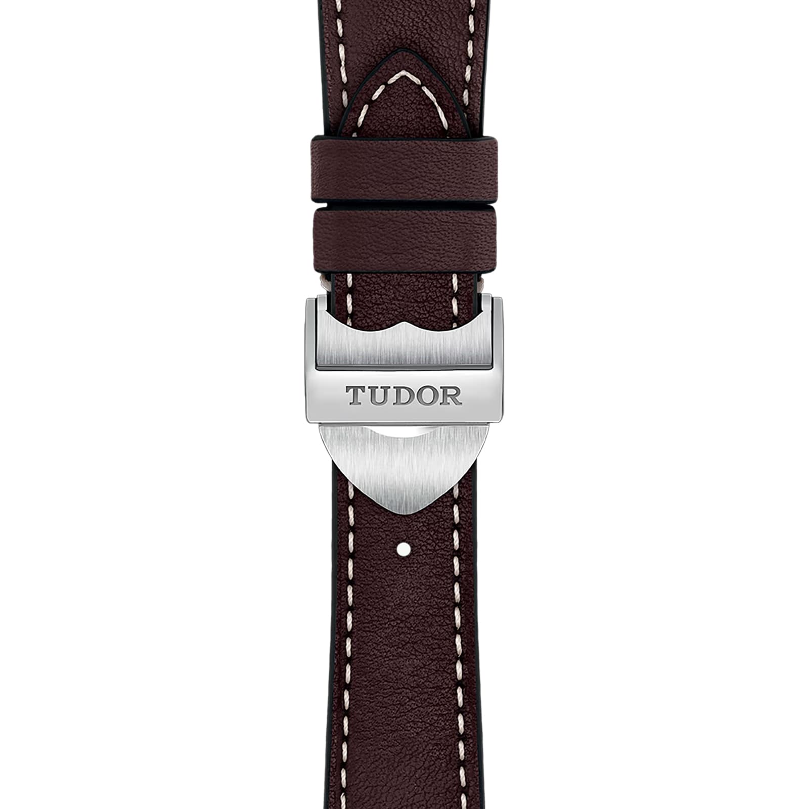 Close-up of a dark brown leather strap with white stitching and a silver clasp engraved TUDOR, highlighting the craftsmanship of the TUDOR 1926 timepiece.