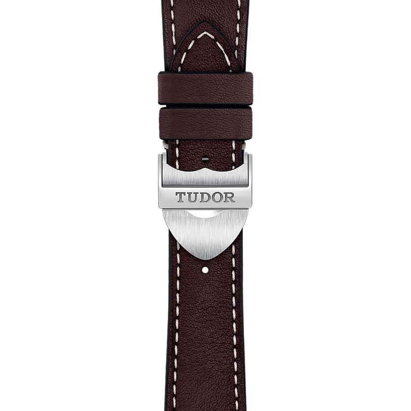 A brown leather strap with white stitching and a silver clasp engraved “TUDOR”—the perfect accessory for TUDOR’s 1926 watch and classic mechanical watch enthusiasts.