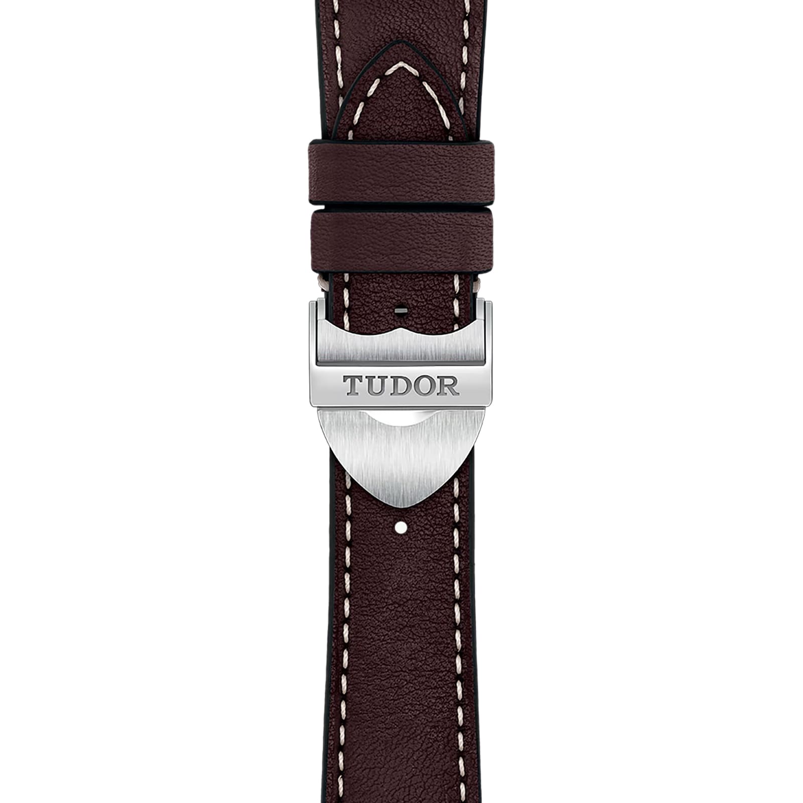 Close-up of a classic brown leather TUDOR 1926 watch strap, featuring white stitching and a silver clasp engraved with the Tudor logo.