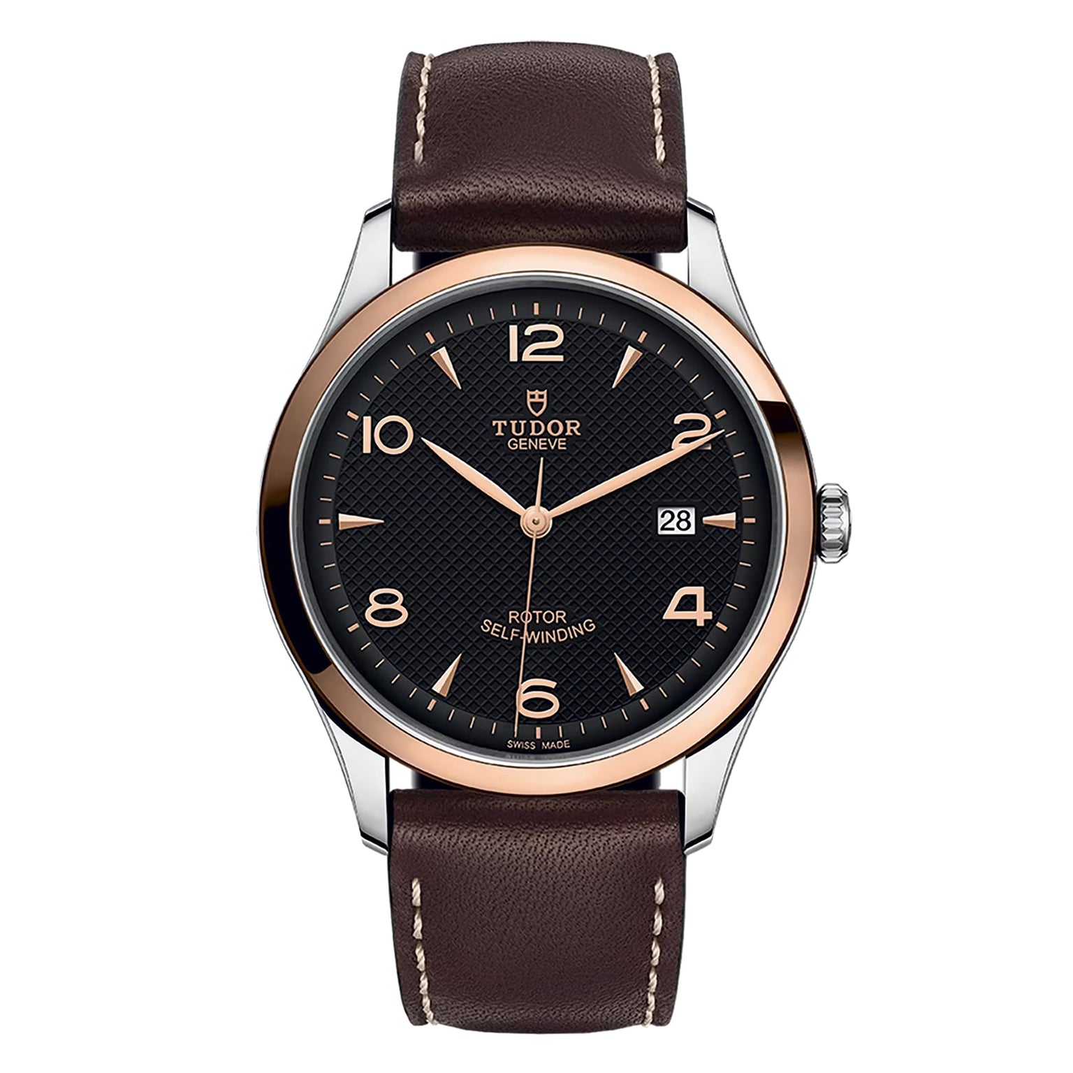 The TUDOR 1926 wristwatch features a brown leather strap, black dial, rose gold bezel, and a date display at 3 o’clock.