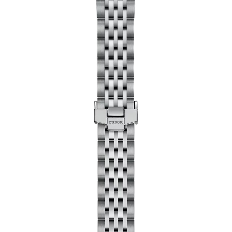 The TUDOR 1926 features a stainless steel five-link bracelet with a folding clasp engraved TUDOR, designed for TUDOR mechanical watches and inspired by Rolex.