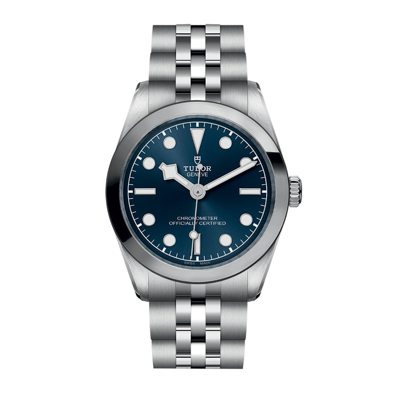 The TUDOR Black Bay One 31 is a unisex stainless steel wristwatch featuring a blue dial, silver hour markers, and a metal link bracelet—a chic design inspired by Black Bay models that embodies timeless elegance.