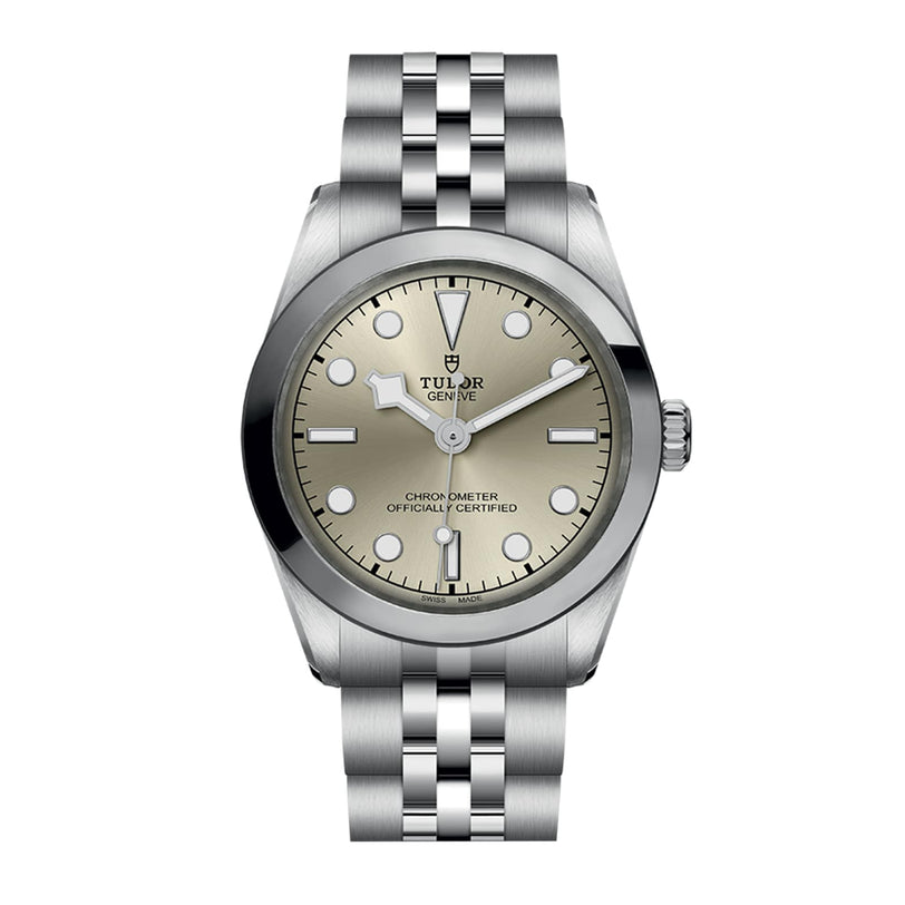 A TUDOR Black Bay One 31 wristwatch with a silver case, light beige dial, and metal link bracelet.