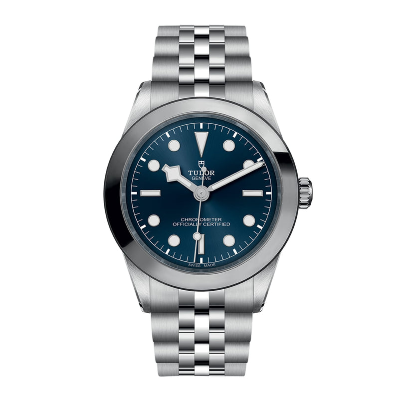 A TUDOR Black Bay One 39 wristwatch with a silver metal bracelet, blue dial, and white hour markers shown on a plain white background.