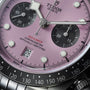 Close-up of the TUDOR Black Bay Chrono, showing its bold pink dial, black subdials, date at 6 o’clock, and stainless steel case. Swiss Chronometer Certified with 200m (660ft) water resistance.