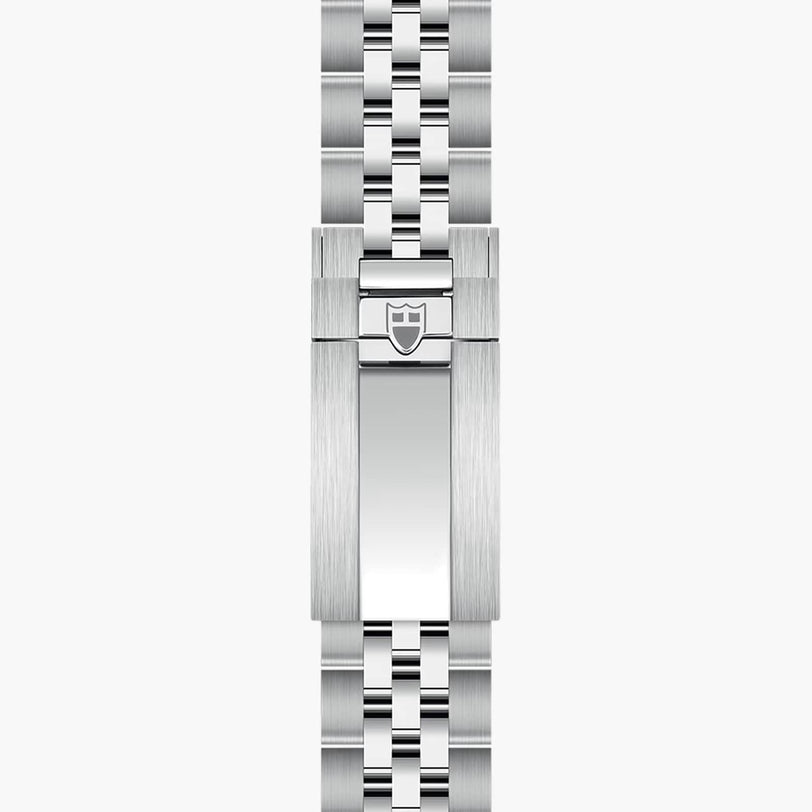 The TUDOR Black Bay 58 features a silver metal watch clasp with a brushed finish and a shield logo, attached to its link bracelet.