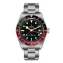 The TUDOR Black Bay 58 GMT is a stainless steel dive watch with a black dial, red and blue bezel, date window at 3 o’clock, and a sturdy metal bracelet.