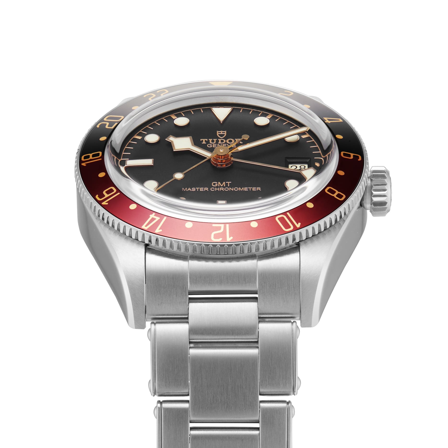 A TUDOR Black Bay 58 GMT stainless steel wristwatch with a black dial, red and black bezel, and metal bracelet, shown against a white background.