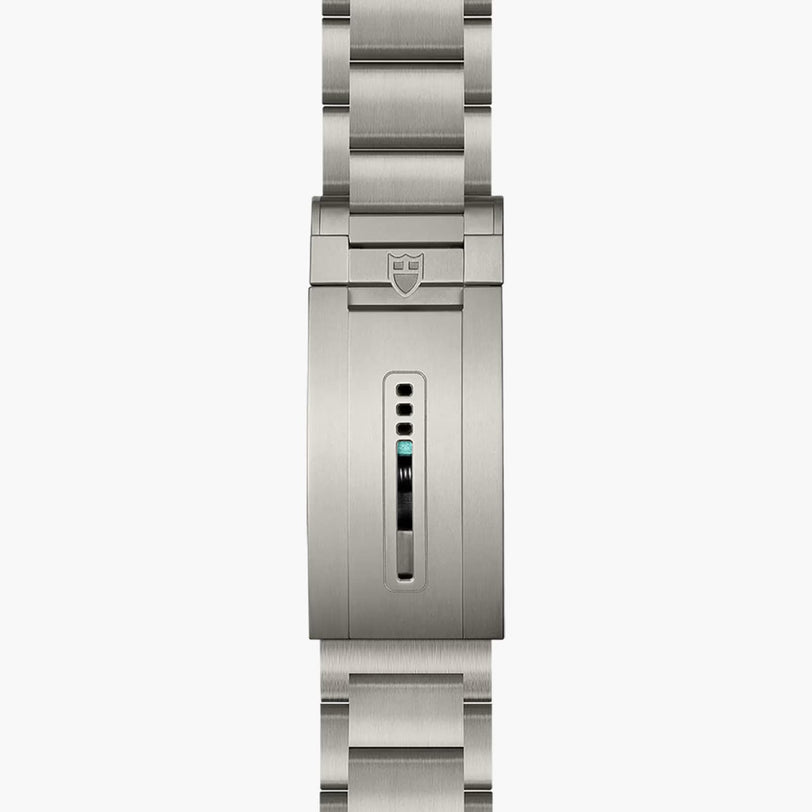 A close-up of the TUDOR Pelagos Ultras stainless steel bracelet clasp, featuring a small rectangular adjustment window.